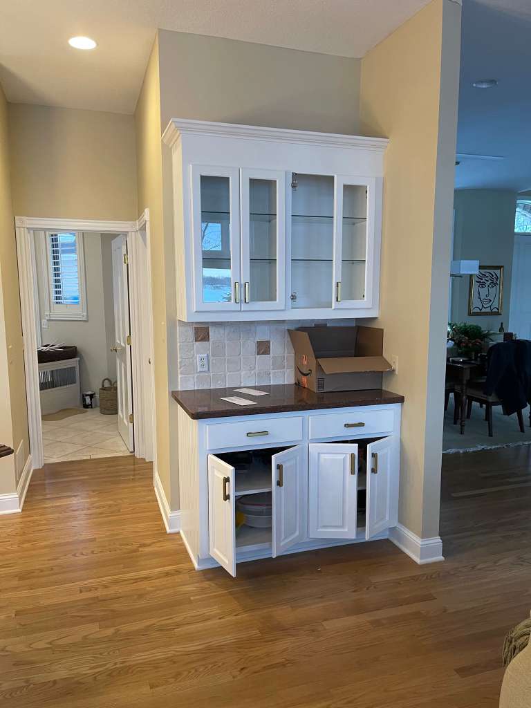 White built-in cabinets and hutch after painting